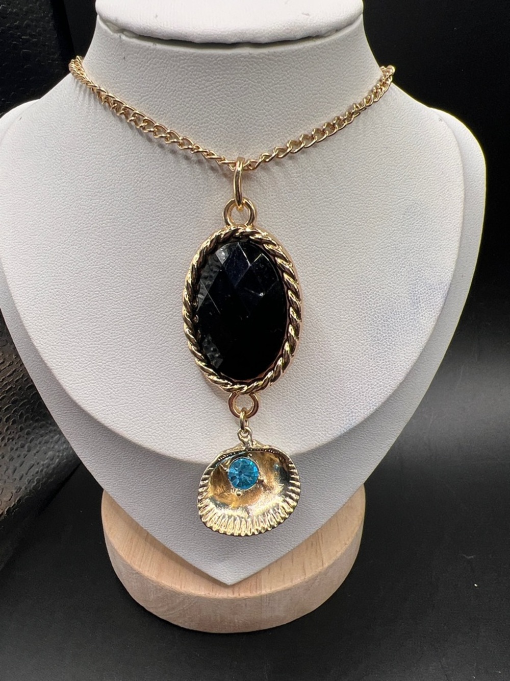 Gold-Tone Pendant Necklace with Black Stone and Blue Accent